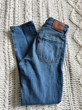 Levi's Genuine Quality Classic Blue Denim Jeans with distressed knee